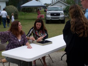 018 Gina and Dianna taking up the money.